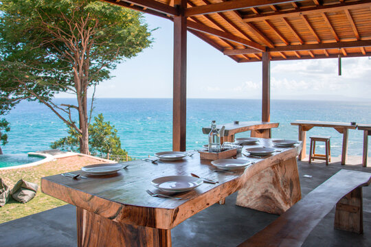 served table in a cafe overlooking the ocean