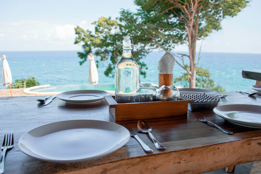 served table in a cafe overlooking the ocean