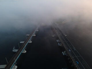 A Foggy morning at Fremantle road and rail bridges, Misty swan river from above. 