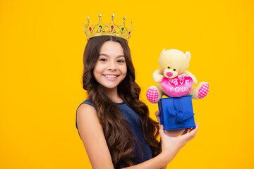 Girls birthday party, funny kid in crown. Imagine herself a queen, child wear diadem. Successful teenager wear luxury beauty queen crown, success. Happy girl face, positive and smiling emotions.
