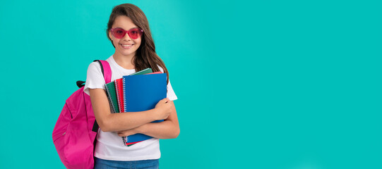 back to school. knowledge day. education. kid in glasses hold copybook. Horizontal isolated poster of school girl student. Banner header portrait of schoolgirl copy space.