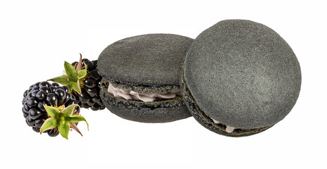 Tasty purple macarons with blackberry  isolated on white background.