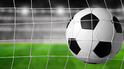 Naklejka premium Soccer ball in the net