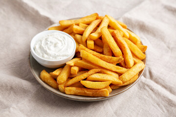 Homemade French Fries with Ranch Dressing on a Plate, low angle view.