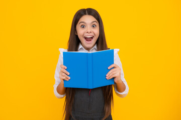 Amazed teen girl. Schoolgirl with copy book posing on isolated background. Literature lesson, grammar school. Intellectual child reader. Excited expression, cheerful and glad.