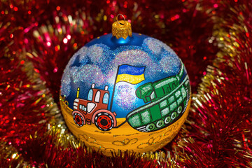 Christmas toy with Ukrainian a tractor that pulls a defeated Russian tank. Stop war in Ukraine. New...