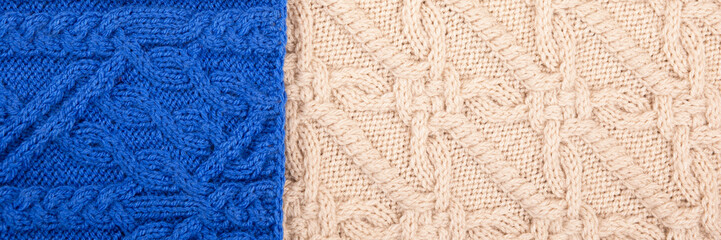Knitted blue and beige background. Large knitted fabric with a pattern. Close-up of a knitted blanket. Banner