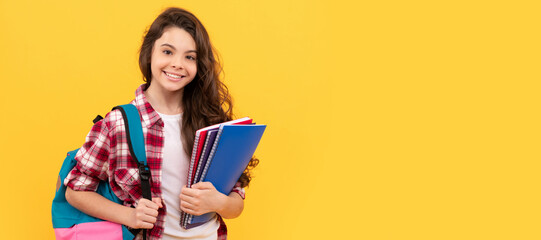 smiling school teen girl ready to study with backpack and notebooks. Portrait of schoolgirl student, studio banner header. School child face, copyspace.