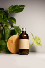 One cosmetic dark amber glass bottle with kraft paper label, minimalism brand packaging mock up