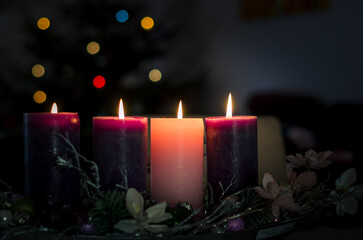 christian advent wreath with 4 burning candles