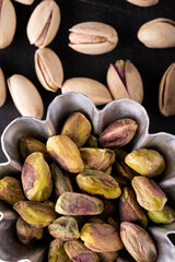in the foreground shelled pistachio seeds