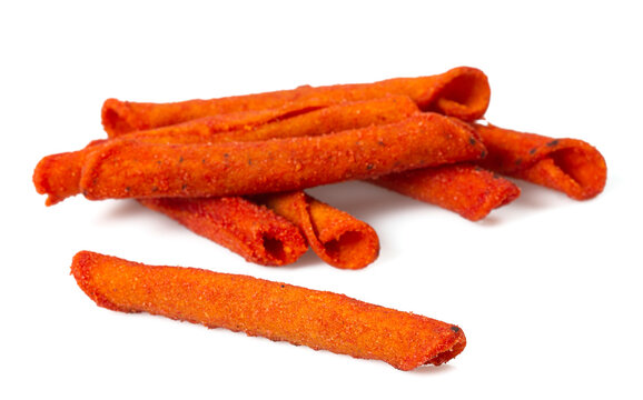Pile of spicy corn chips isolated on white background. Hot rolled chips.