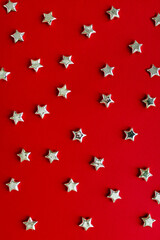 Christmas background. Silver stars christmas decoration on red background