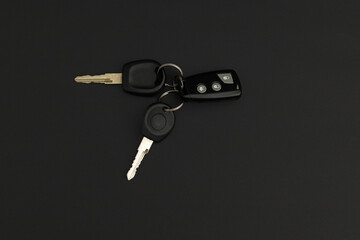Car keys on black background