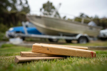 wood chocks for a caravan and camping. chocks behind a tyre. camping chocks for a boat trailer of travellers
