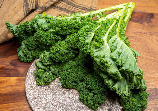 Leaves of winter vegetable green kale cabbage close up