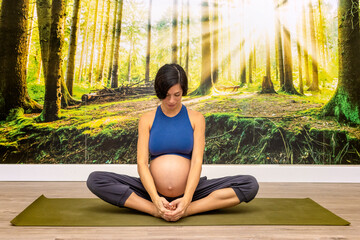 Prenatal Yoga. Yoga instructor in lotus position.