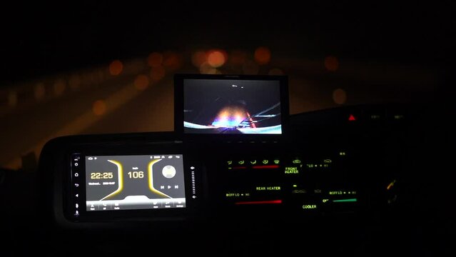 video player interface in van with night traveling on Road