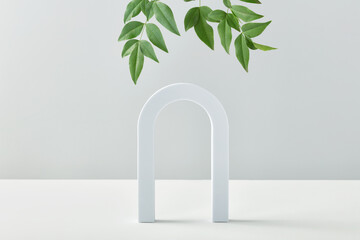 Cosmetic art deco arch display in pastel color for product presentation