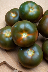 Fresh ripe sweet reddish brown and green kumato tomatoes