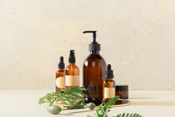 Amber glass bottles on beige background. Soap liquid, shampoo or shower gel, serum, essential oils,...