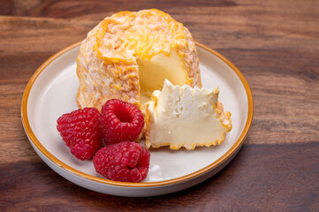French Langres soft cows crumbly cheese with washed rind structure made in Champagne - Ardenne region
