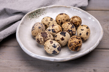Fresh small spotted partridge or quail bird eggs