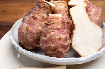 Group of fresh uncooked topinambur or Jerusalem artichoke roots