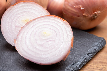 Bunch of french AOP pink onions from Roscoff village in Brittany, France