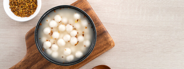 Little white tangyuan with sweet osmanthus honey and syrup soup.