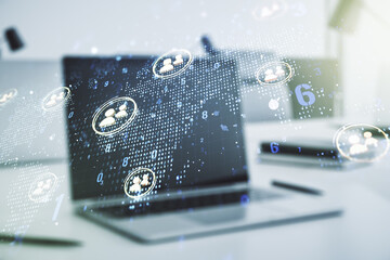 Double exposure of social network icons concept with world map and modern laptop on background. Marketing and promotion concept