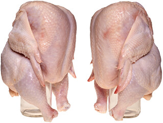 Chicken on a bottle. Raw chicken is dressed on a transparent glass bottle for baking in the oven.