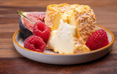 French Langres soft cows crumbly cheese with washed rind structure made in Champagne - Ardenne region