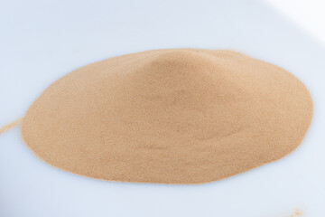 Small size fine Sand flying pile, Golden grain like glass. Abstract silica material set. Yellow colored sand close up detail texture. White background Isolated