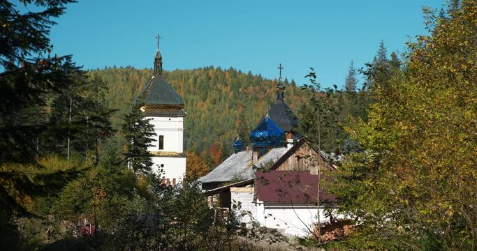 Manyava Skete of Exaltation of Holy Cross in forest, Carpathian mountains, Ukraine. Orthodox solitary cell mens monastery, skete. Near skete in wood there is Blessed Stone, object of worship