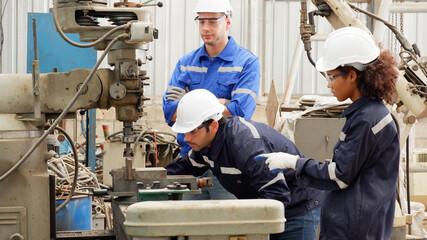 Engineers doing maintenance work on machines. industry concept.