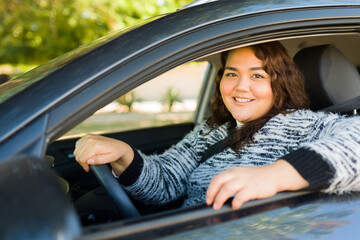 Portrait of a happy big woman driving