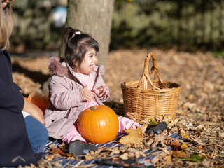 Mother and daughter with Down syndrome playing in park