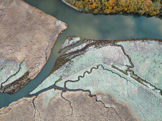 Top Down view over Marshland of River Teign shrouded in frost at morning sun from a drone, Newton...