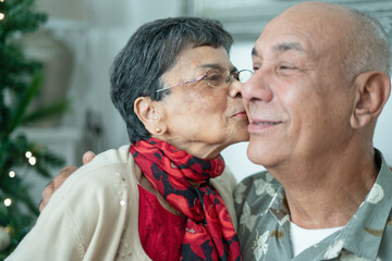 Close-up of senior woman kissing man