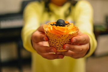 Halloween cupcakes. cupcake in hands