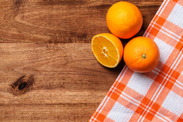 oranges checkered cloth on wood