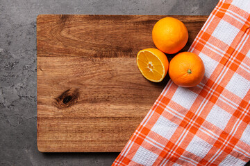 oranges checkered cloth on wood