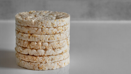 Plain rice cakes on grey background copy space on right