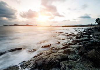 Sunset on the rocky shore.
