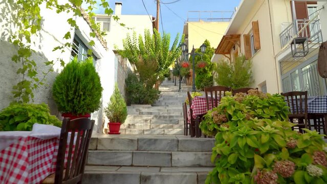 Stone Stairs and Cute and Small Restaurant Tables in City of Delphi