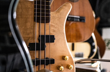 Bass guitar fretboardsand strings in music recording studio closeup. Musical instrument for live...