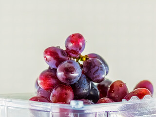 Blue grapes for dessert with a cup of coffee