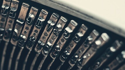Letters and numbers on typo keys of an old manual typewriter on a retro writing machine, close up...