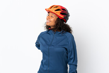 Teenager cyclist woman isolated on white background looking side - obrazy, fototapety, plakaty